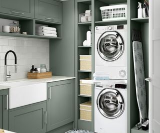 small utility room with stacked appliances