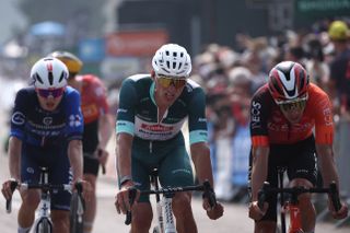 Alpecin-Deceuninck's Dutch rider Mathieu van der Poel (C) wearing the sprinter's green jersey reacts as he crosses the finish line of the 3rd stage of the 77th edition of the Criterium du Dauphine cycling race, 207,2 km between Brioude and Charantonnay, on June 10, 2025. (Photo by Anne-Christine POUJOULAT / AFP) (Photo by ANNE-CHRISTINE POUJOULAT/AFP via Getty Images)