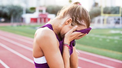 Woman suffering from anxiety whilst running