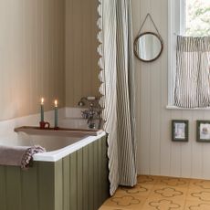 budget bathroom ideas, neutral bathroom with striped shower curtain and matching cafe blind, cork floor, green painted bath, tongue and groove 