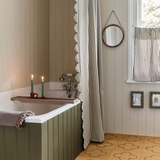 budget bathroom ideas, neutral bathroom with striped shower curtain and matching cafe blind, cork floor, green painted bath, tongue and groove