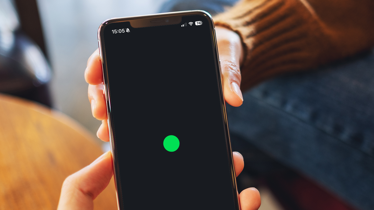 A hand holding a phone showing the Letterboxd app