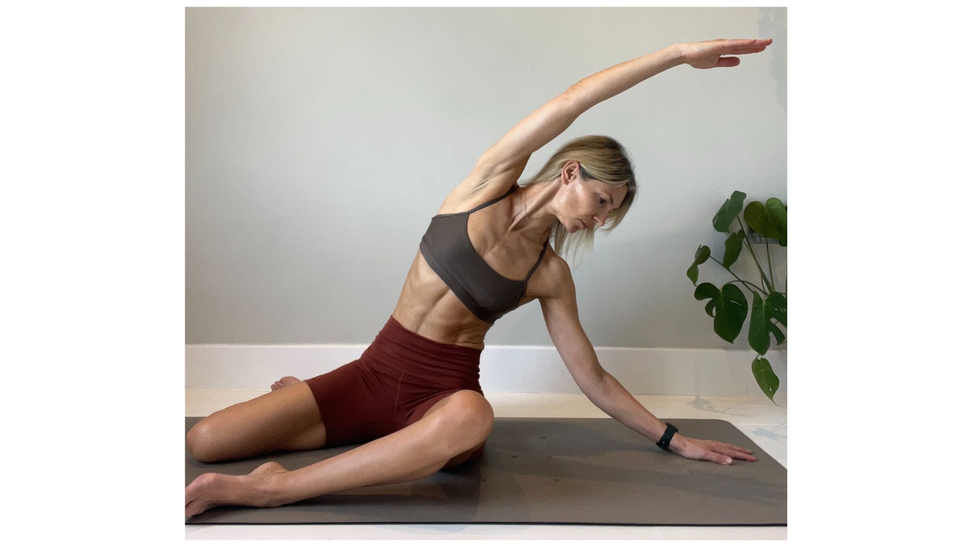 Shape Pilates founder Gemma Folkard demonstrating a lateral stretch