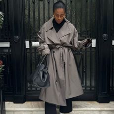 Marilyn NK wearing a trench coat.