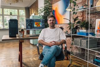 image of a man in an office sitting down on a chair