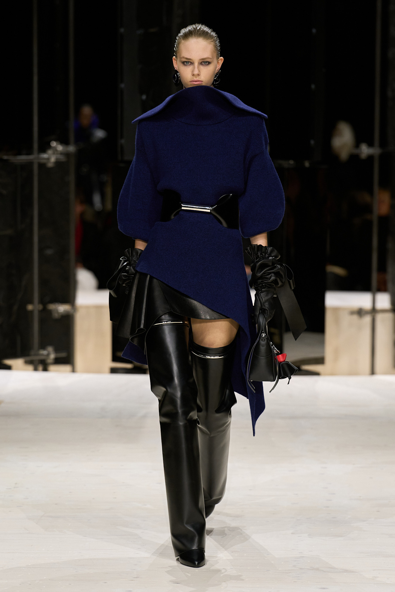 a givenchy model wears knife boots on f/w 26 runway.