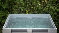 A cold plunge tub filled with ice water