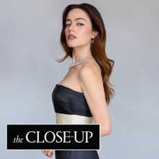 molly gordon poses wearing a black and white armani dress and tiffanys necklace at the 2025 emmys