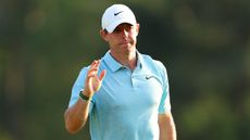 Rory McIlroy acknowledges the crowd after completing his opening round of the 2023 Masters
