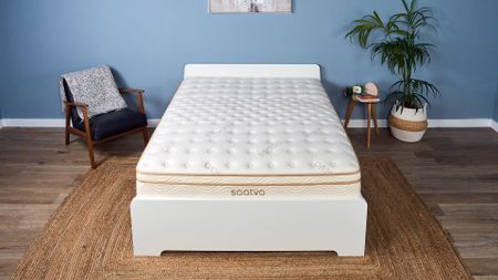 The Saatva Classic mattress on a bed frame in our Tom's Guide Sleep Studio, decorated to look like a bedroom