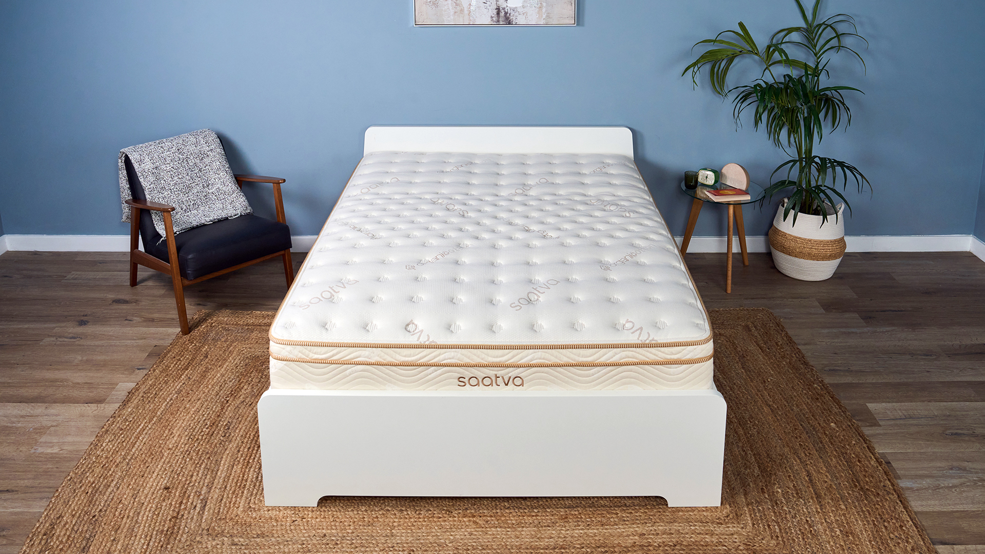 The Saatva Classic mattress on a bed frame in our Tom's Guide Sleep Studio, decorated to look like a bedroom