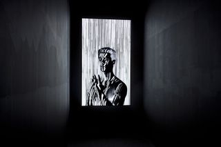 Black and white lit up picture of man