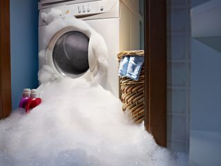 washing machine with suds flooding out