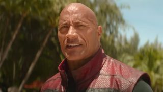 The Rock about to fight snowmen on a beach in Red One.