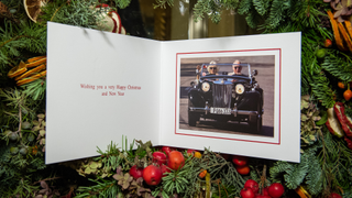 The 2019 Christmas card of Prince Charles, Prince of Wales and Camilla, Duchess of Cornwall on a Christmas tree at Clarence House on December 20, 2019 in London, England. The card features a photograph of the royal couple driving a vintage MG TD whilst on tour in Cuba, The Prince and Duchess became the first British royals to visit the island nation in March 2019