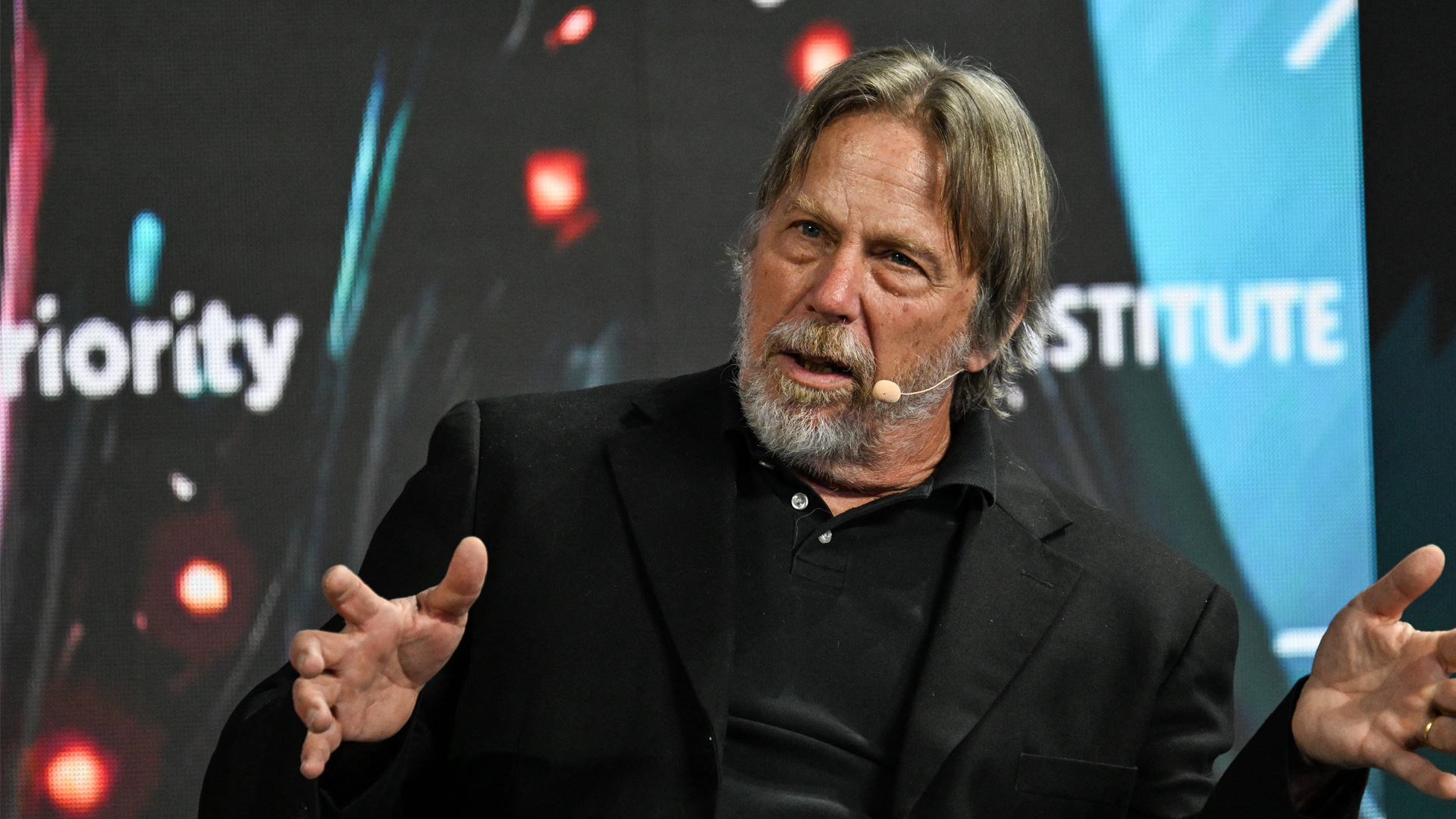 Jim Keller giving a talk at a show.