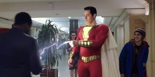 Zachary Levi as Shazam charging av phone via lightning fingers