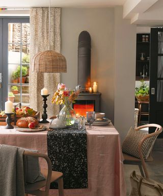 Dining room curtain ideas with a stove and neutral curtains with delicate pattern