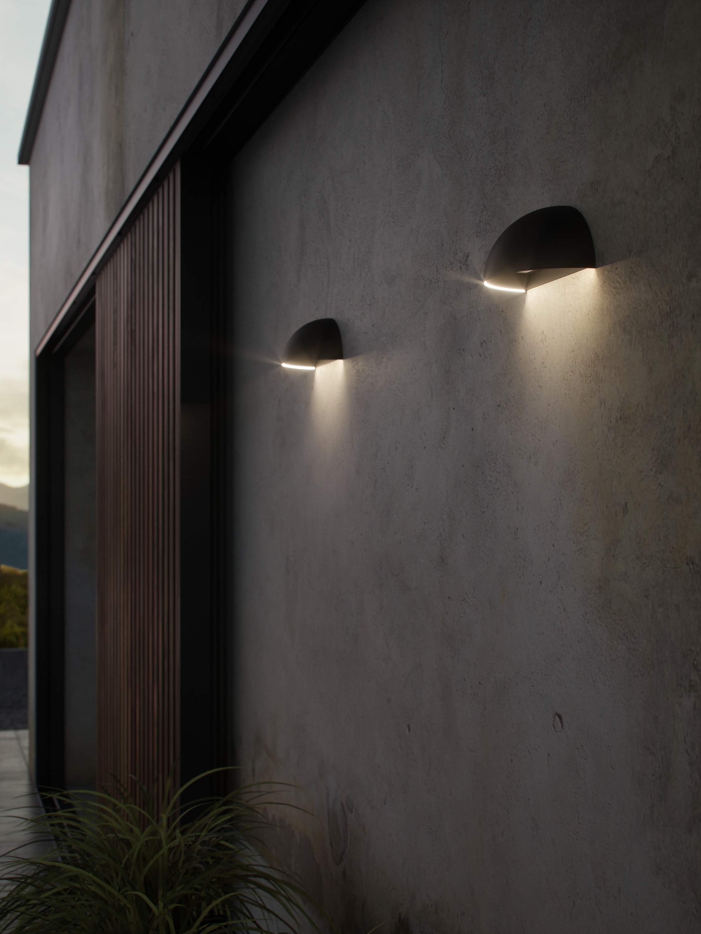 pair of security wall lights on a concrete wall of a modern home