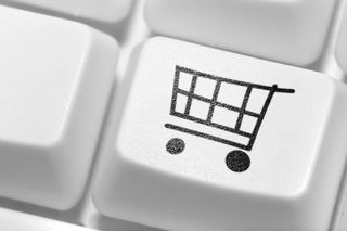 Shopping trolley icon on computer keyboard