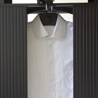 a close up of a white shirt in the Effie ironing machine