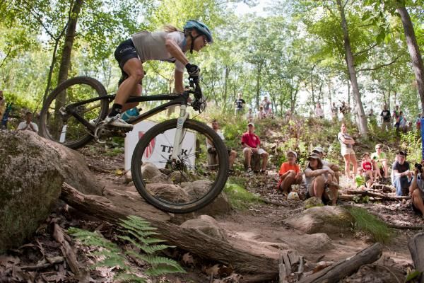 Crowds gather to watch winner Judy Freeman (Crank Brothers Racing) fly through the Trek Firelane.