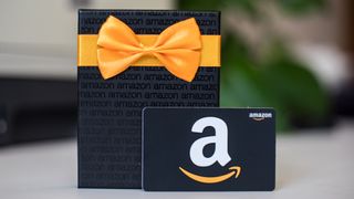 Amazon gift card shown next to gift box