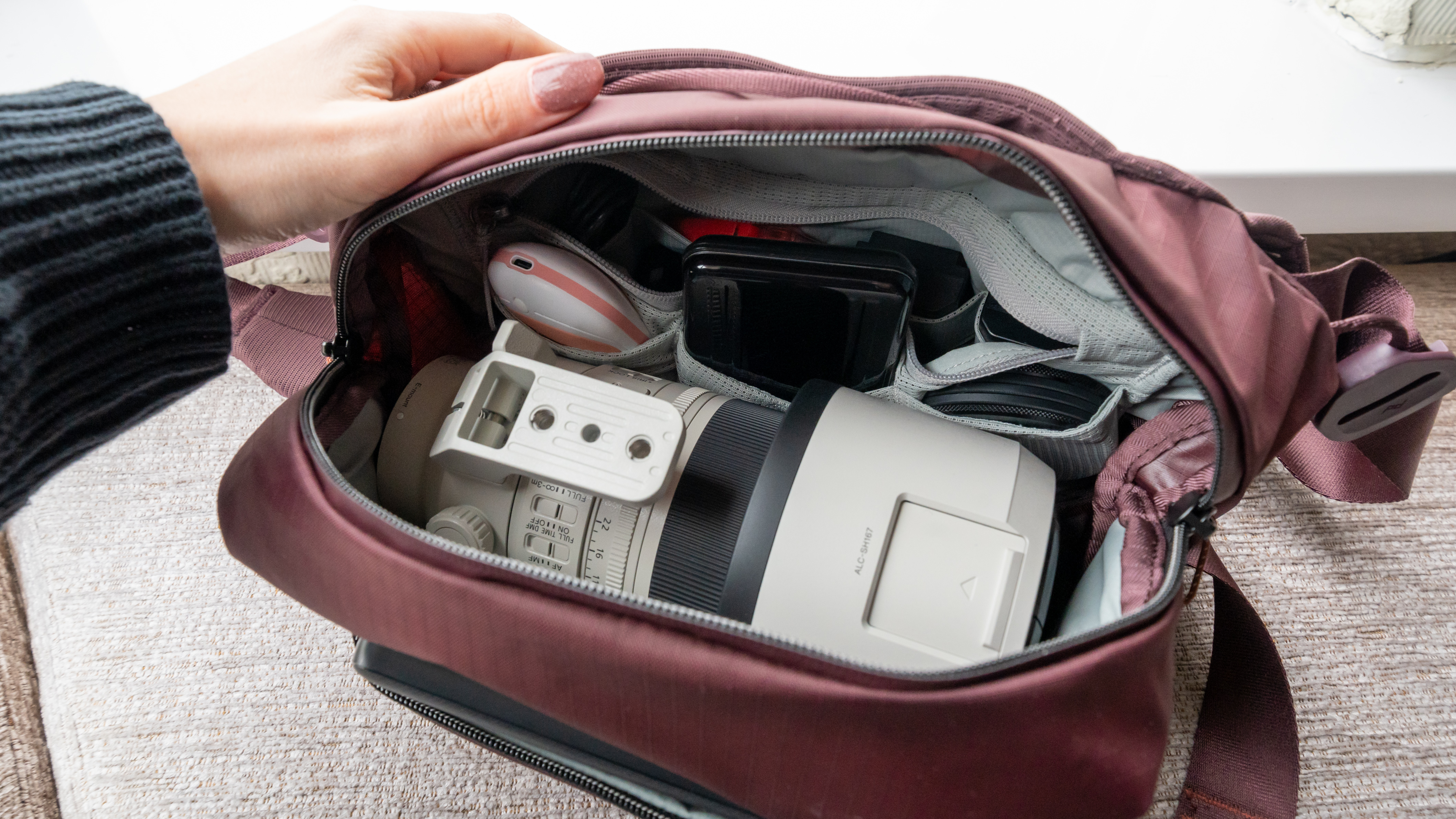 photography equipment inside the Peak Design sling bag