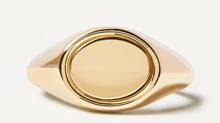 A gold stamp signet ring, one of the best personalized jewelry gifts.