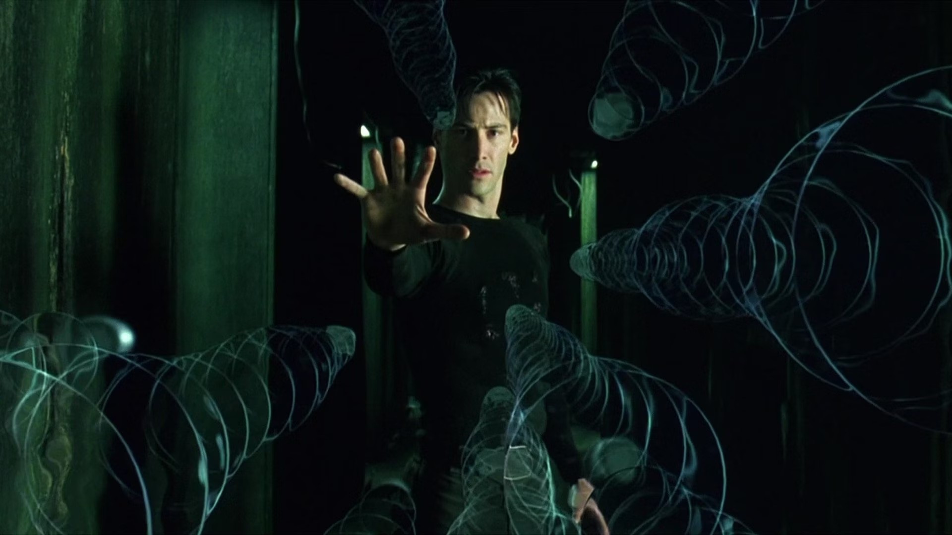 Keanu Reeves surrounded by The Matrix