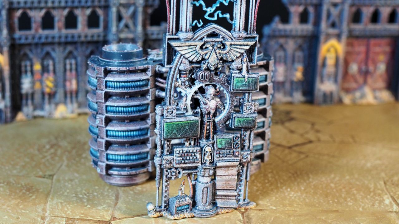 Warhammer 40K pre-painted terrain showing a man hooked up to various monitors and machines