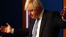 Boris Johnson gestures during a No. 10 press conference
