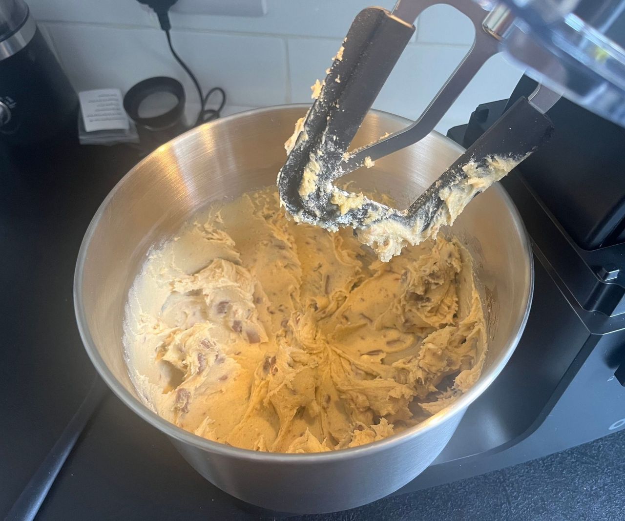 Cookie dough in the metal bowl of the Ooni Halo Core Spiral Mixer