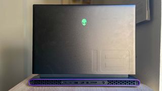 Alienware m18 review unit on desk, rear facing camera