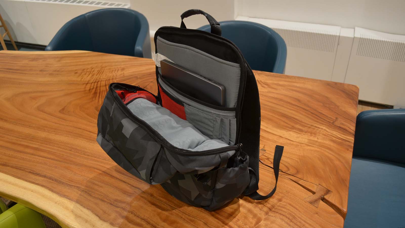 A Hex Technical Backpack on a wood grain table