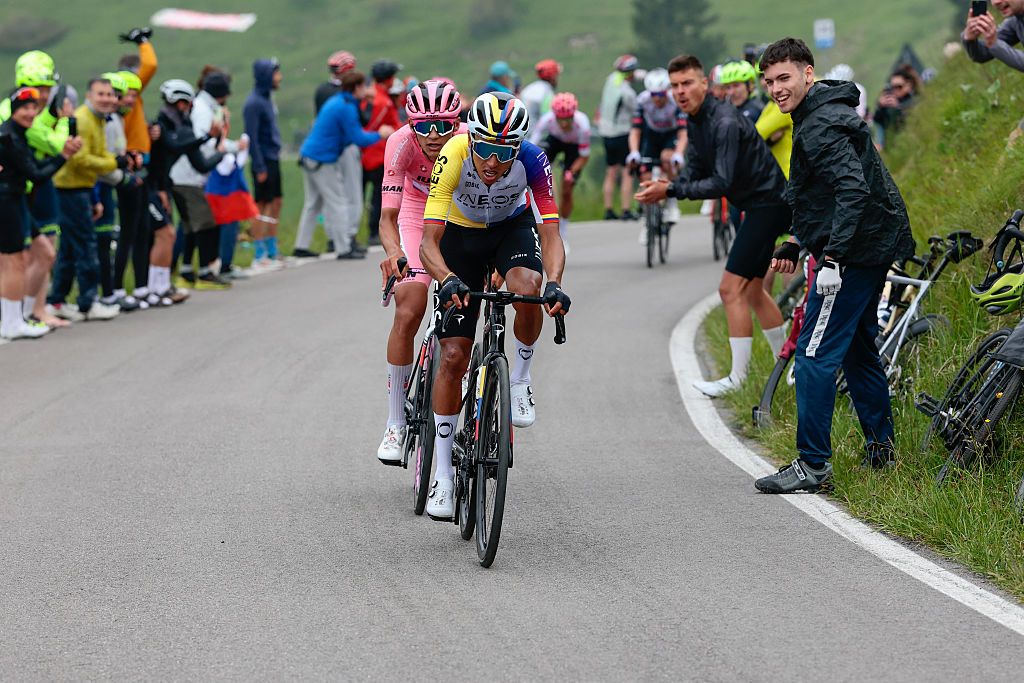 Ineos Grenadiers' Colombian rider Egan Bernal rides ahead of UAE Team Emirates XRG's Mexican rider Isaac Del Toro wearing the pink jersey of overall leader (Maglia Rosa) in the ascent of Monte Grappa during the 15th stage of the 108th Giro d'Italia cycling race of 219kms from Fiume Veneto to Asiago on May 25, 2025. (Photo by Luca Bettini / AFP)