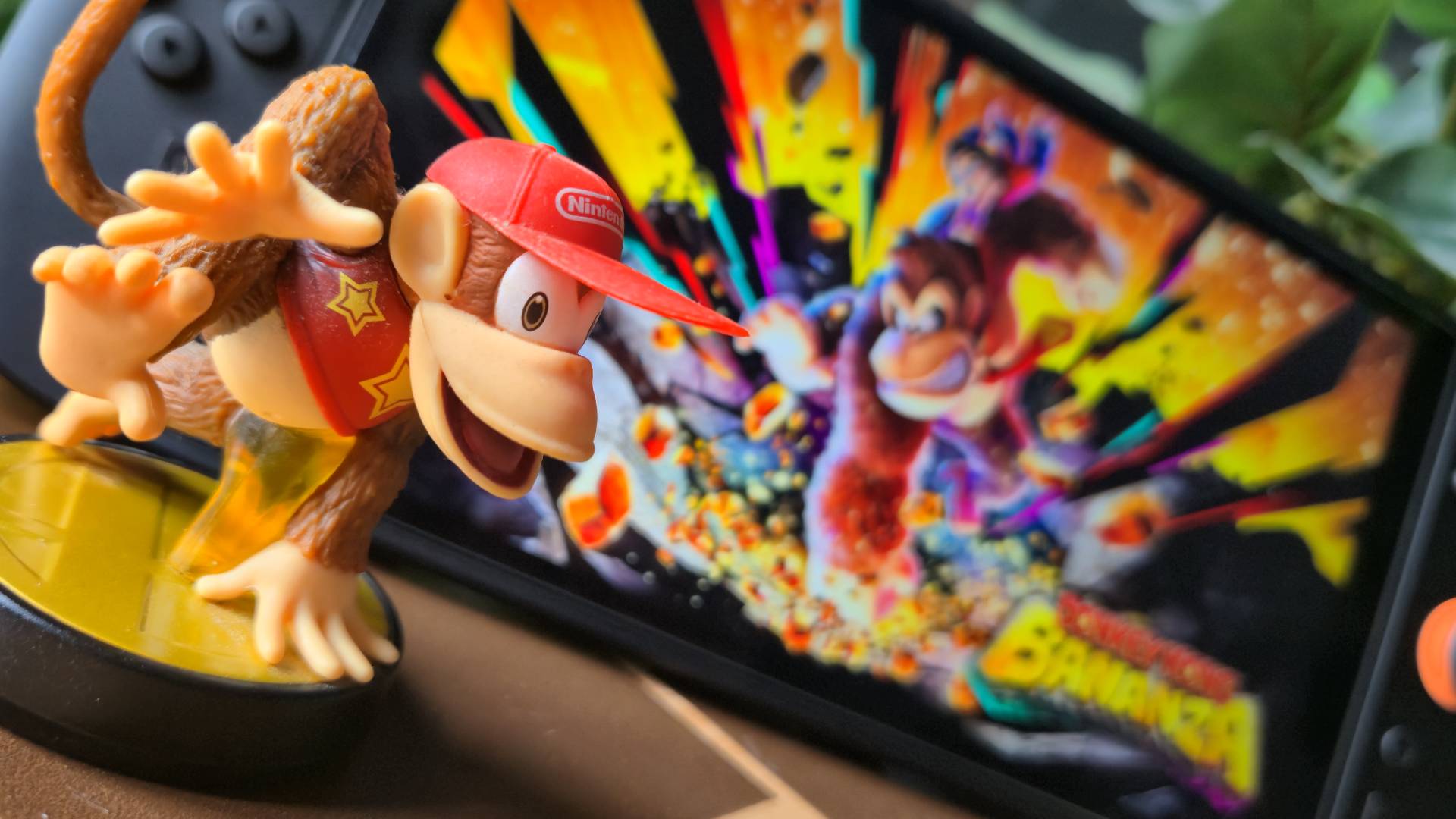 Photo by Rosalie Newcombe of the Diddy Kong Smash Bros amiibo sitting in-front of a Nintendo Switch 2.