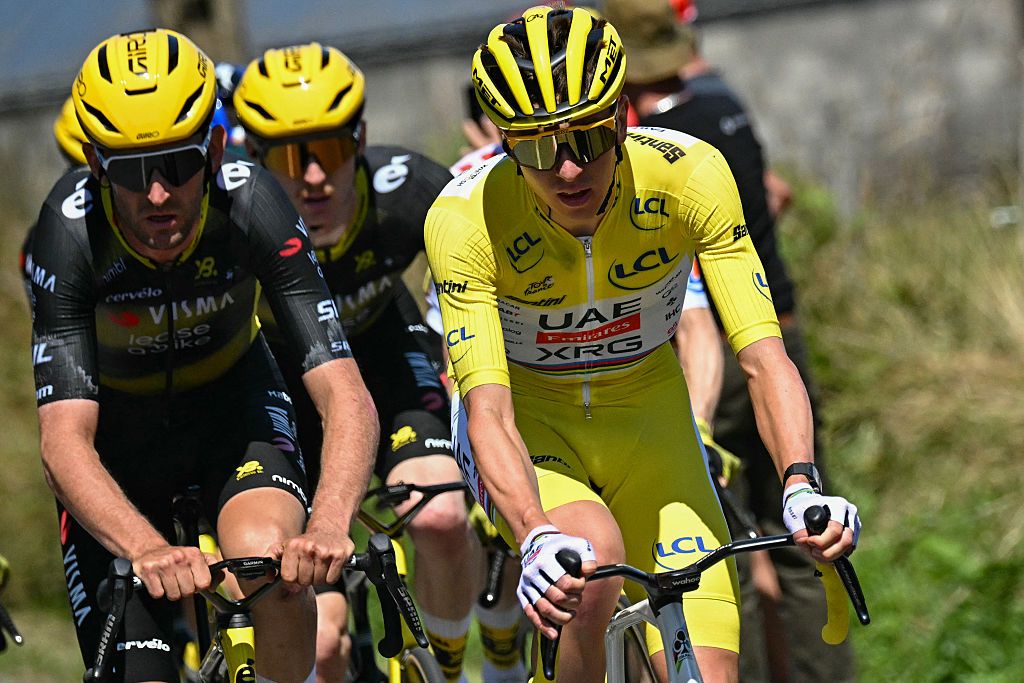 UAE Team Emirates - XRG team's Slovenian rider Tadej Pogacar wearing the overall leader's yellow jersey (R) and Team Visma - Lease a bike team's Belgian rider Tiesj Benoot (L) cycle during the 6th stage of the 112th edition of the Tour de France cycling race, 201.5 km between Bayeux and Vire Normandie, Northwestern France, on July 10, 2025. (Photo by Loic VENANCE / AFP) (Photo by LOIC VENANCE/AFP via Getty Images)