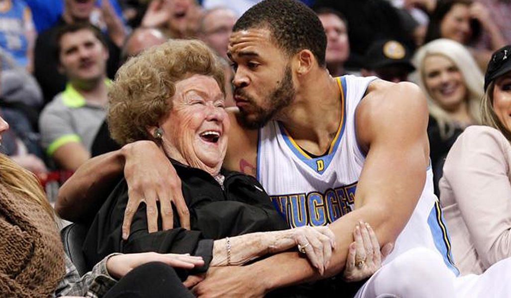 Watch the Denver Nuggets&amp;#039; JaVale McGee fall into a courtside fan, plant a kiss on her