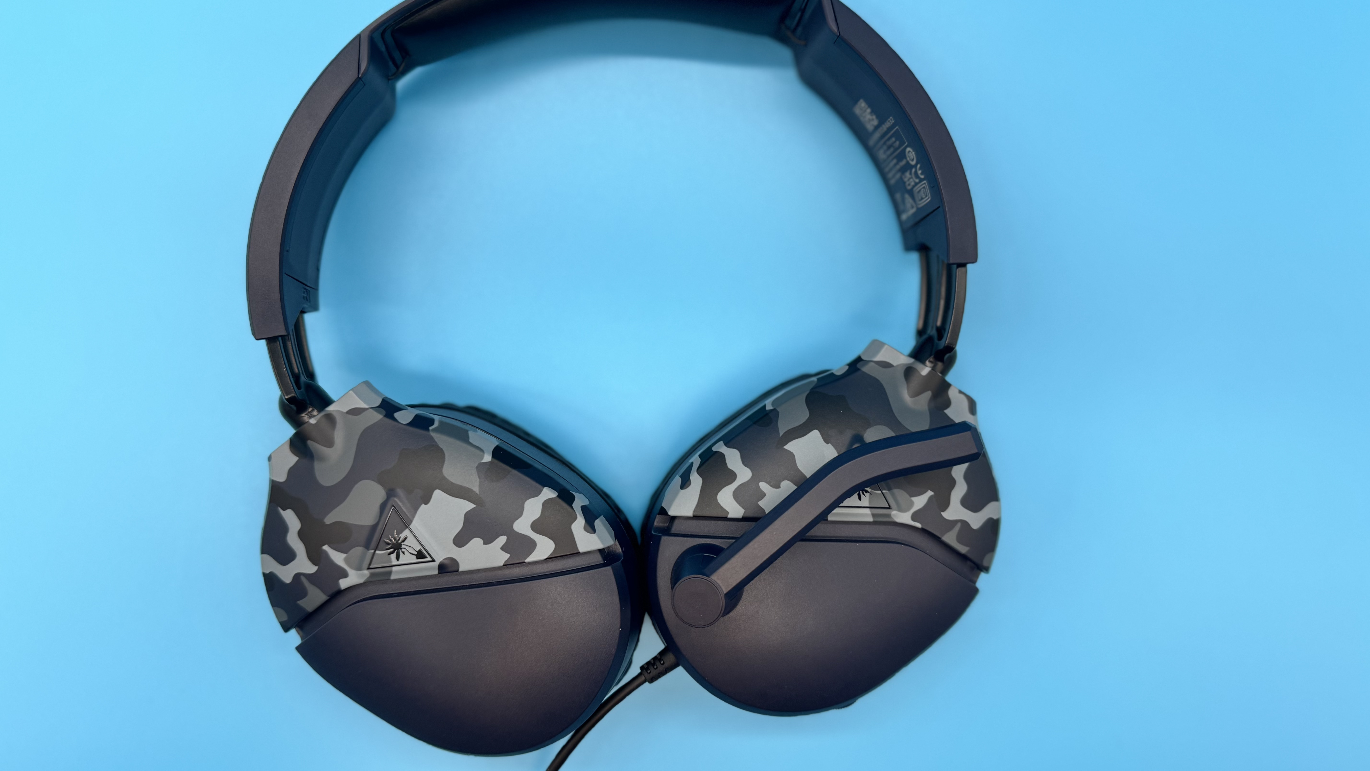 Turtle Beach Recon 70 gaming headset on a blue background