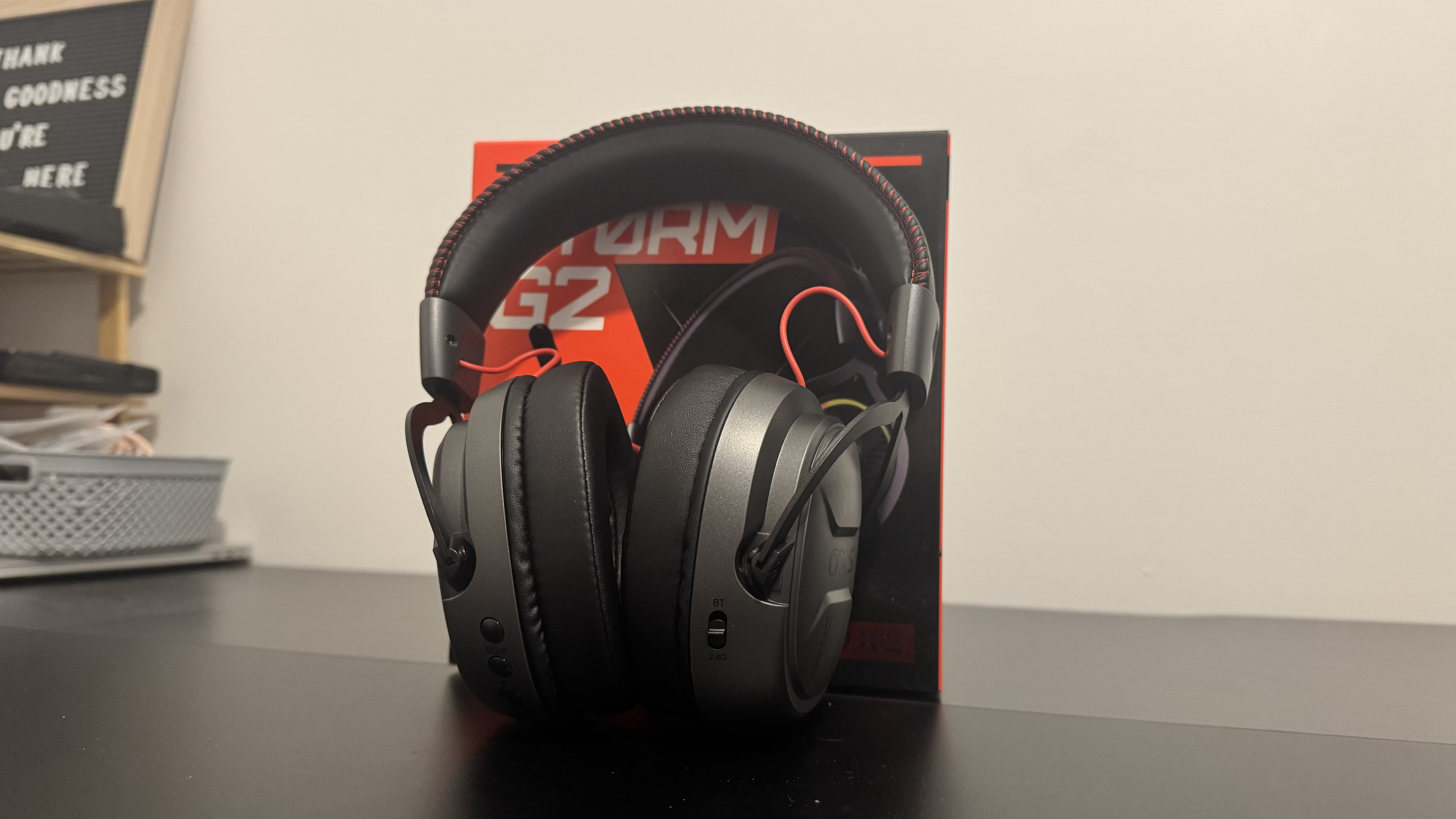 The OXS Storm G2 gaming headset on a black table