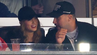 Taylor Swift and Travis Kelce attend the Yankees vs Guardians Game wearing matching baseball caps and black jackets