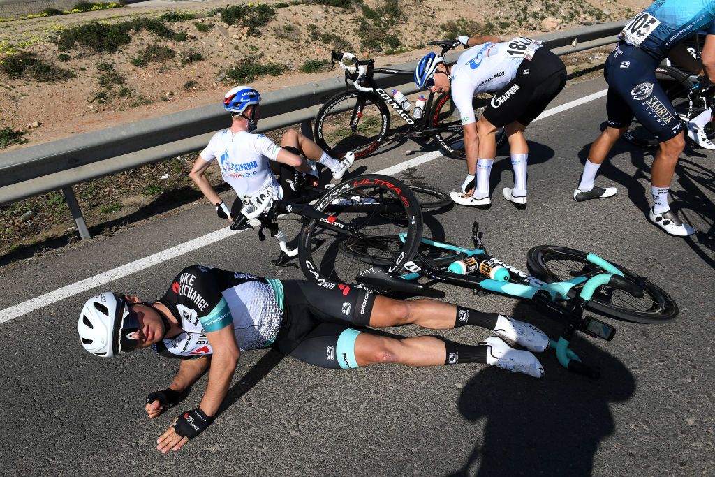 ROQUETAS DE MAR SPAIN FEBRUARY 14 Robert Stannard of Australia and Team BikeExchange Marco Canola of Italy and Team GazpromRusVelo during the 34th Clsica de Almeria 2021 a 1833km race from Pueblo de Vicar to Roquetas de Mar Crash Injury ClasicaAlmeria21 on February 14 2021 in Roquetas de Mar Spain Photo by Tim de WaeleGetty Images