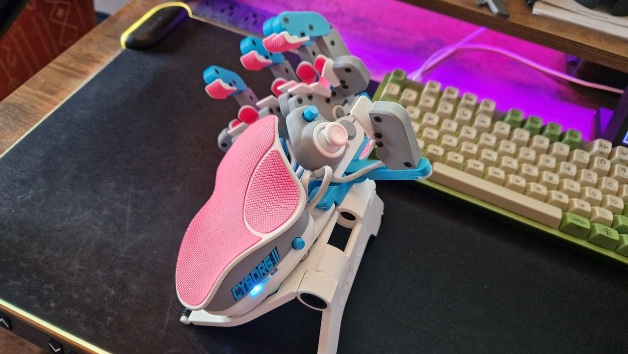 An Azeron Cyborg II propped up on its magnetic stand