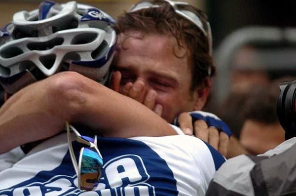 An emotional Alessandro Petacchi is congratulated by a team-mate