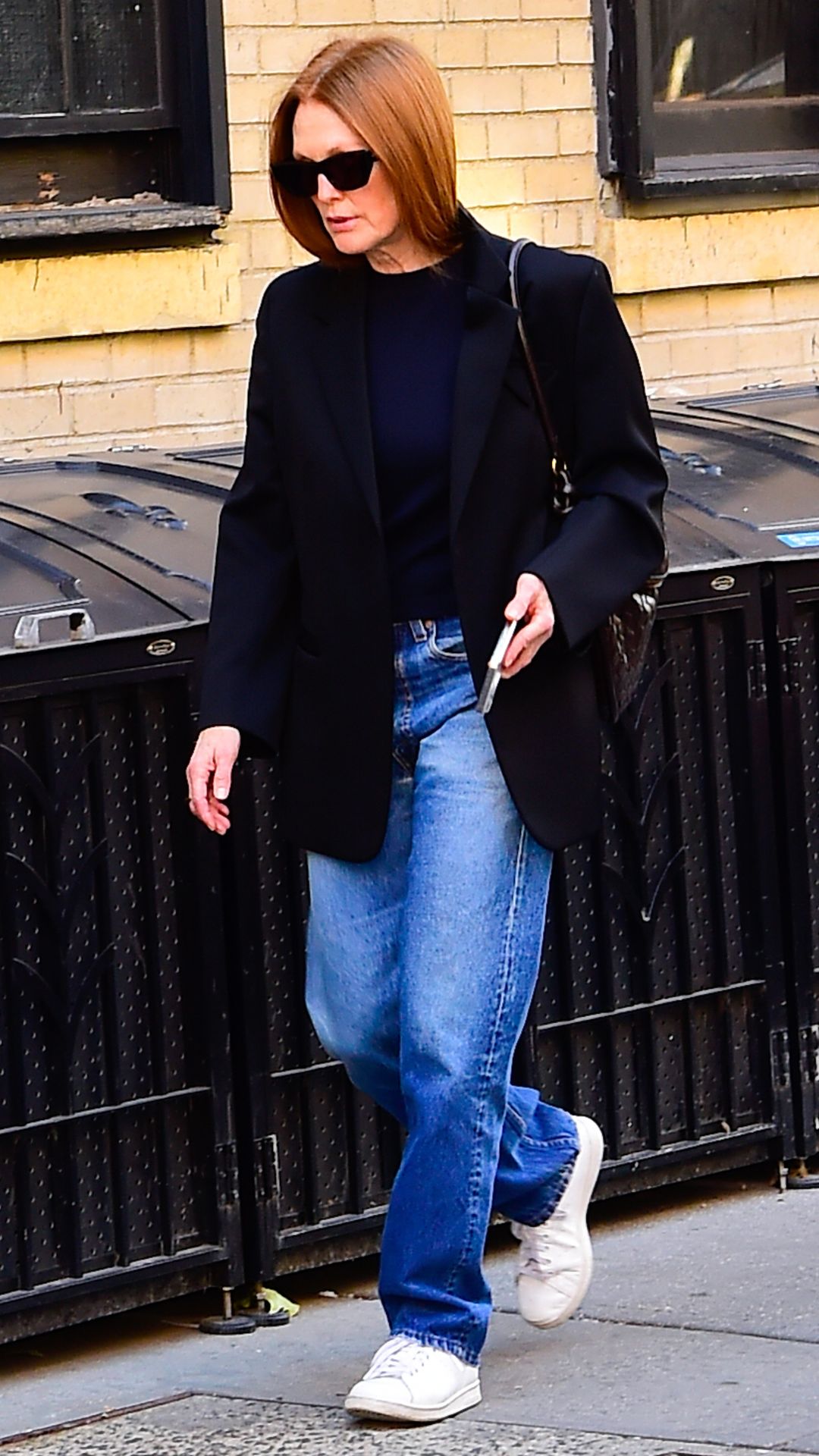 Juilanne Moore wearing white stan smith trainers