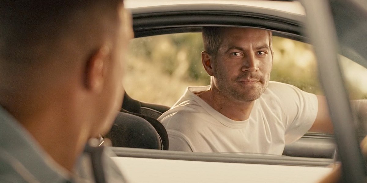 Paul Walker and Vin Diesel say goodbye in their cars in Furious 7.