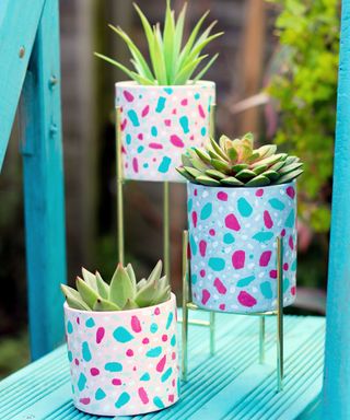 A set of three DIY plant stands with Terrazzo effect decor
