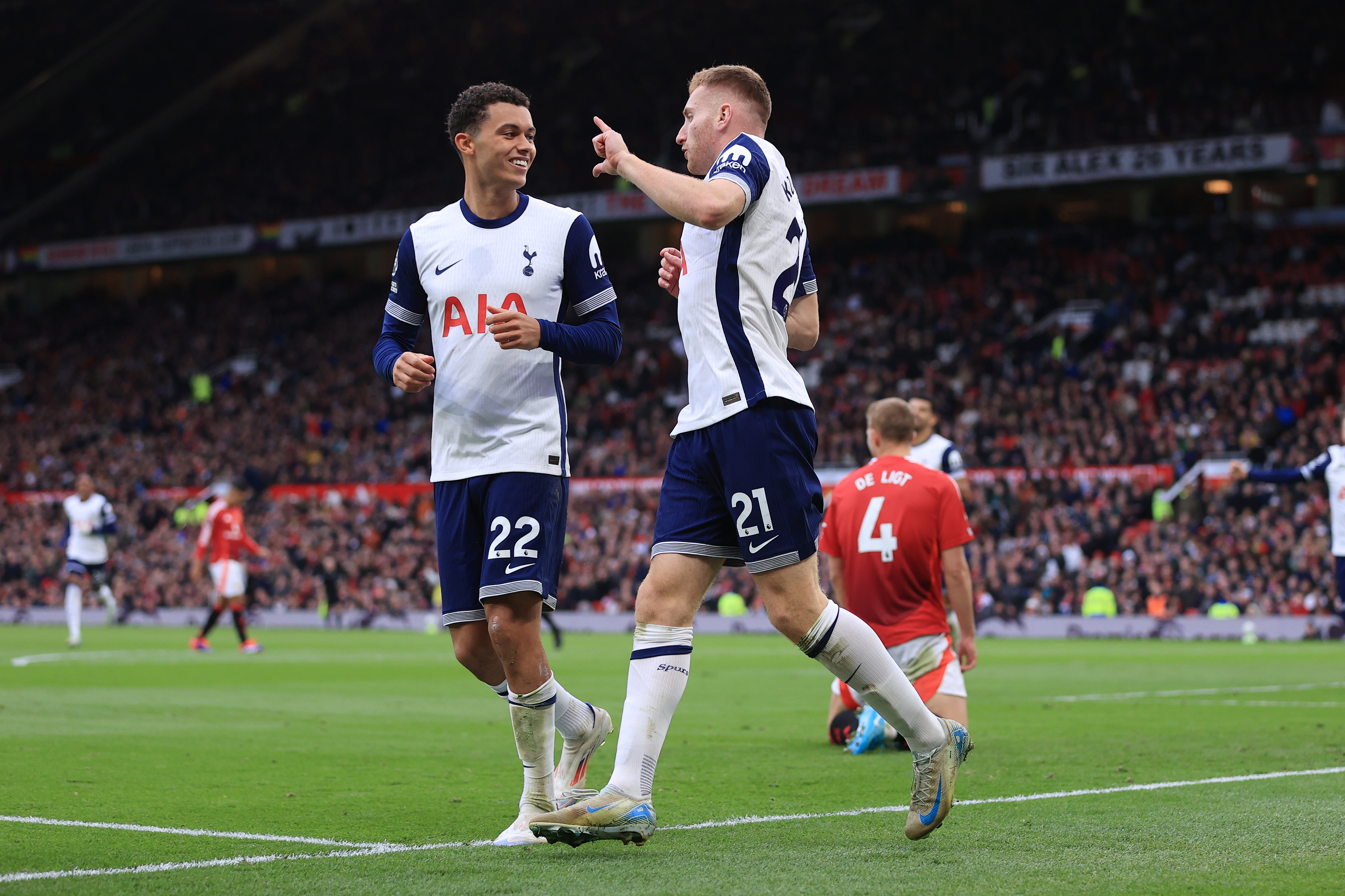 Dejan Kulusevski and Brennan Johnson celebrate a goal for Tottenham against Manchester United at Old Trafford in the Premier League in September 2024.