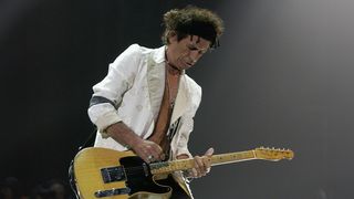 Rolling Stones' guitarist Keith Richards performs at the Rod Laver Arena February 25, 2003 in Melbourne, Australia. The Rolling Stones will play in three major Australian cities as part of their 40 Licks World Tour 2003